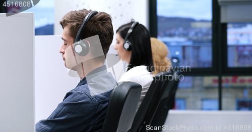 Image of male call centre operator doing his job