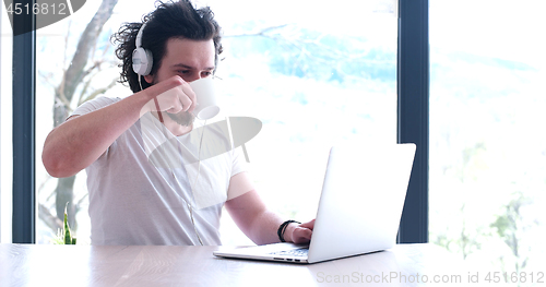 Image of man drinking coffee enjoying relaxing lifestyle