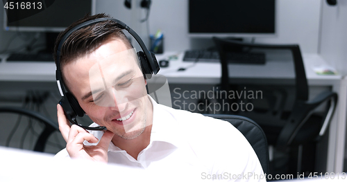 Image of male call centre operator doing his job