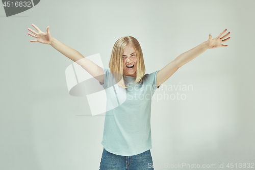 Image of Winning success woman happy ecstatic celebrating being a winner. Dynamic energetic image of female model