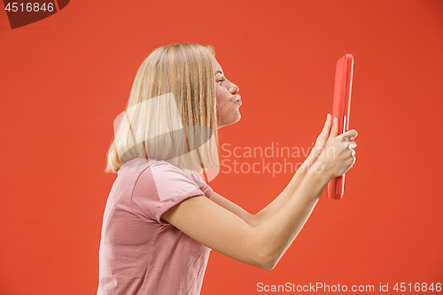 Image of Businesswoman hugging laptop. Love to computer concept. Attractive female half-length front portrait