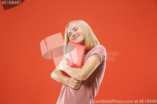 Image of Businesswoman hugging laptop. Love to computer concept. Attractive female half-length front portrait