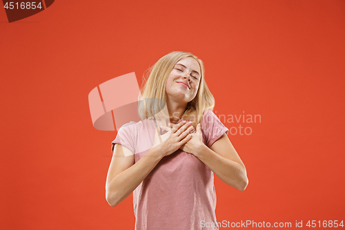 Image of happy woman. image of female model on red