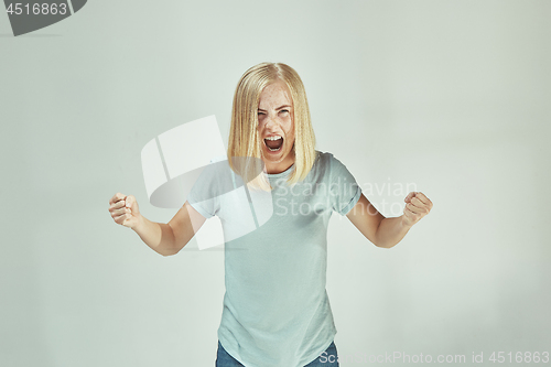 Image of A portrait of surprised screaming woman