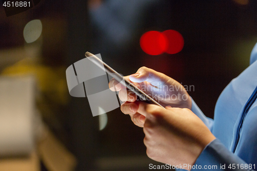 Image of close up of businesswoman hands with smartphone