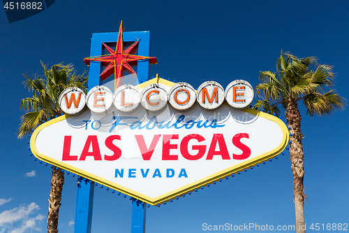 Image of welcome to fabulous las vegas sign and palm trees