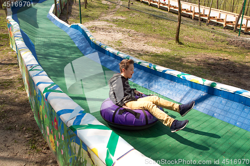 Image of Happy boy with tube