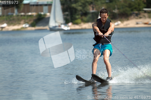 Image of Man riding water skis