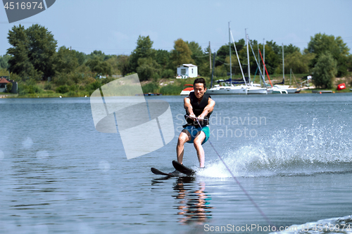 Image of Man riding water skis