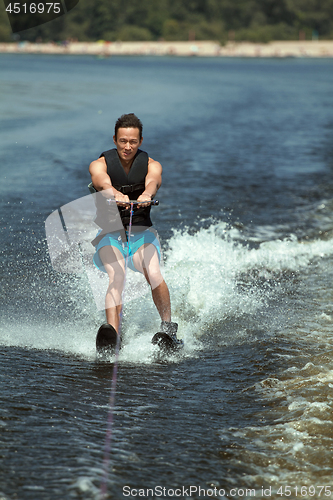 Image of Man riding water skis