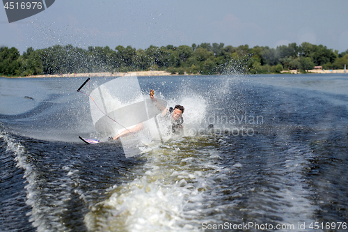 Image of Man riding water skis