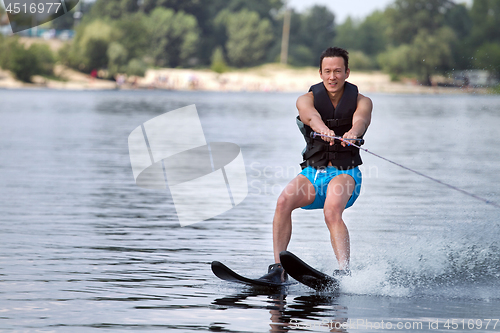 Image of Man riding water skis