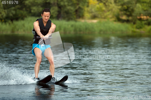 Image of Man riding water skis