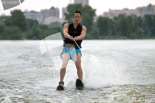 Image of Man riding water skis