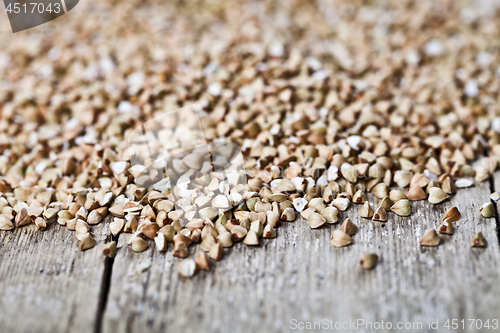 Image of Organic green dry buckwheat seads closeup on rustic wooden backg