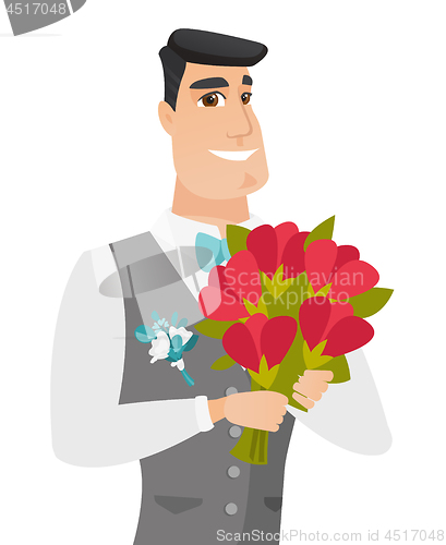 Image of Young caucasian groom with bridal bouquet.