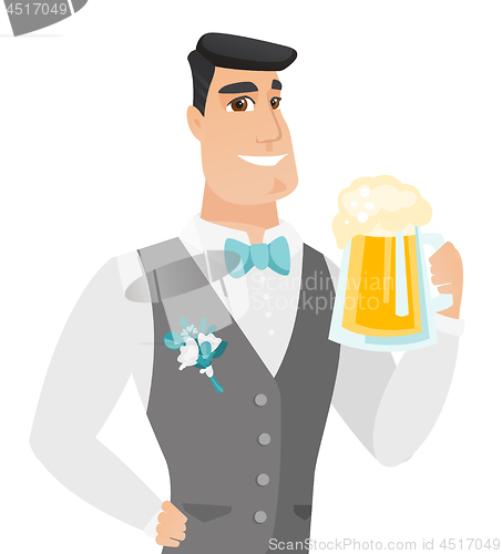 Image of Young caucasian groom drinking beer.