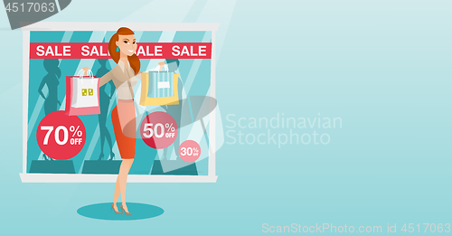 Image of Young caucasian woman shopping on sale.