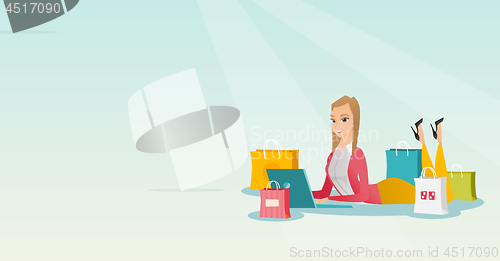 Image of Young caucasian woman doing online shopping.