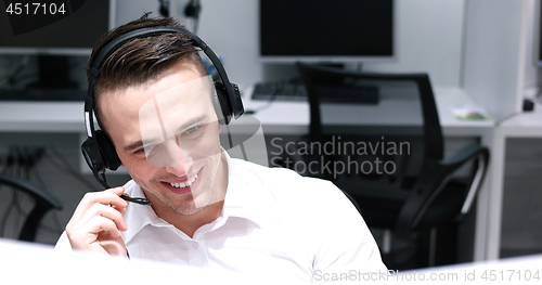 Image of male call centre operator doing his job