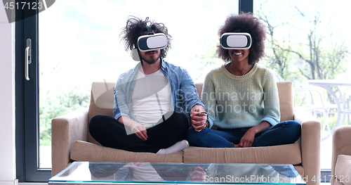 Image of Multiethnic Couple using virtual reality headset