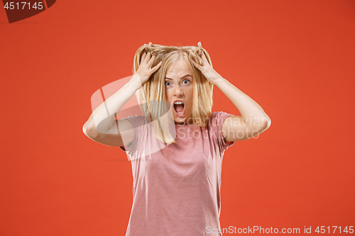 Image of A portrait of surprised screaming woman