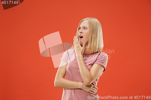 Image of Beautiful bored woman bored isolated on red background