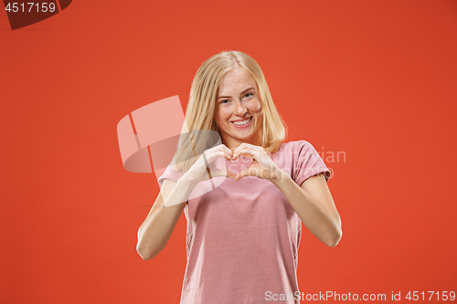 Image of Portrait of attractive cute girl with kiss isolated over red background