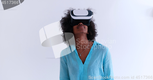 Image of black girl using VR headset glasses of virtual reality