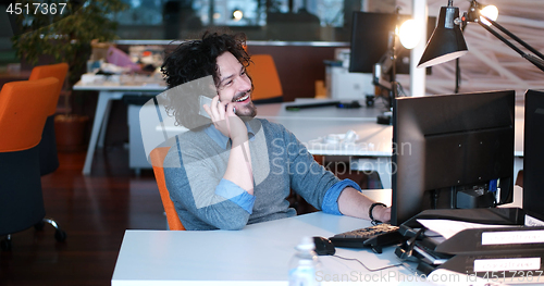Image of businessman working using a computer in startup office