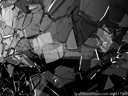 Image of Pieces of glass shattered or cracked on black