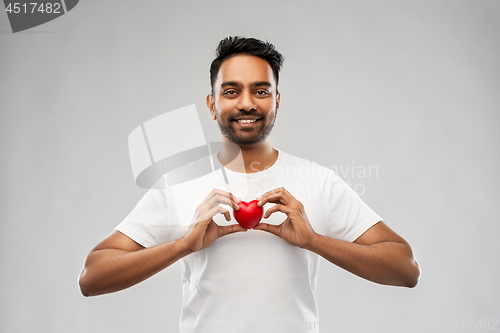 Image of indian man with red heart over grey background