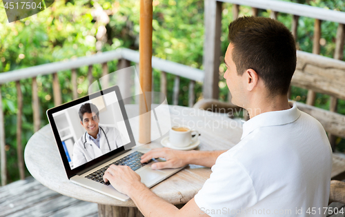 Image of man having video chat with doctor on laptop