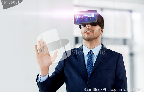Image of businessman with virtual reality headset at office