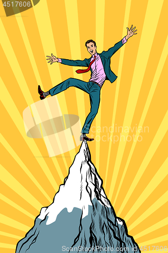 Image of businessman at the top of the mountain