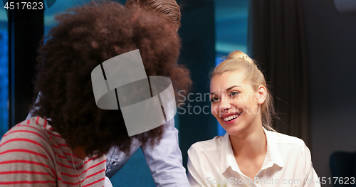 Image of Multiethnic startup business team in night office