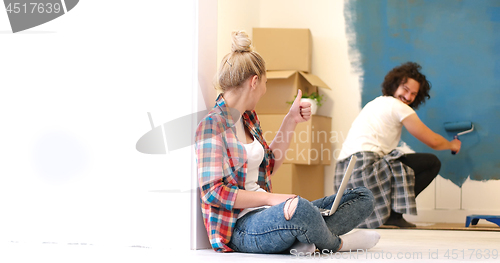 Image of Happy couple doing home renovations