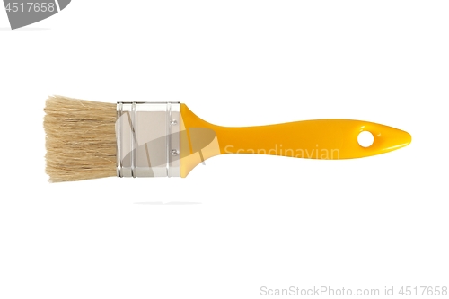 Image of Yellow paintbrush on white