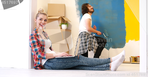 Image of Happy couple doing home renovations