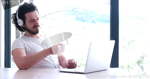 Image of man drinking coffee enjoying relaxing lifestyle