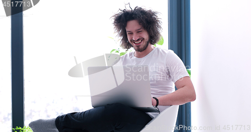 Image of man drinking coffee enjoying relaxing lifestyle