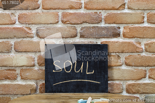 Image of Chalk board with the word SOUL drown by hand and chalks on woode