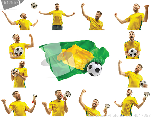 Image of Brazilian fan celebrating on white background. The young man in soccer football uniform with ball standing at white studio. Fan, support concept. Human emotions concept.