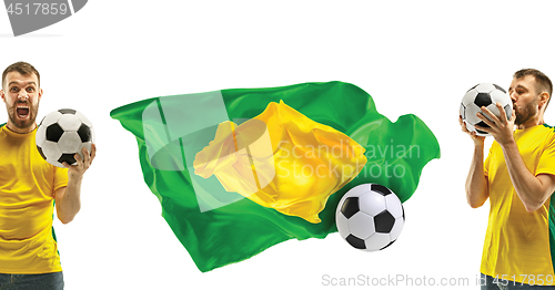 Image of Brazilian fan celebrating on white background. The young man in soccer football uniform with ball standing at white studio. Fan, support concept. Human emotions concept.