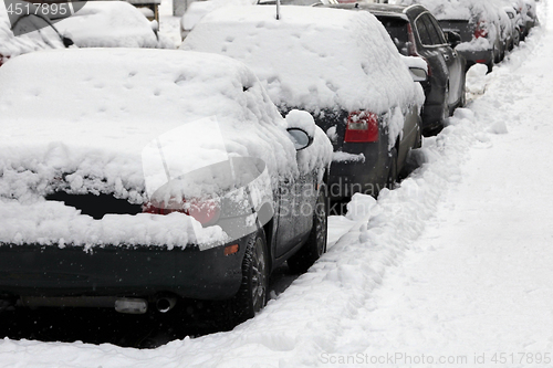 Image of Parked Cars Under Snow