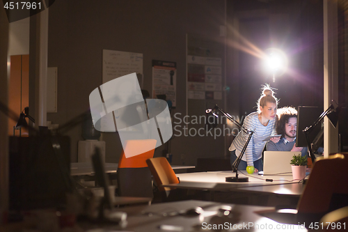 Image of young designers in the night office