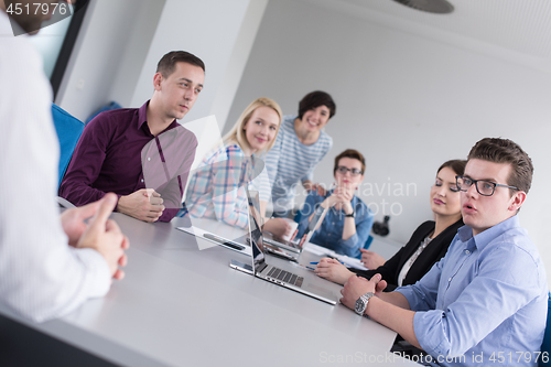 Image of Business Team At A Meeting at modern office building