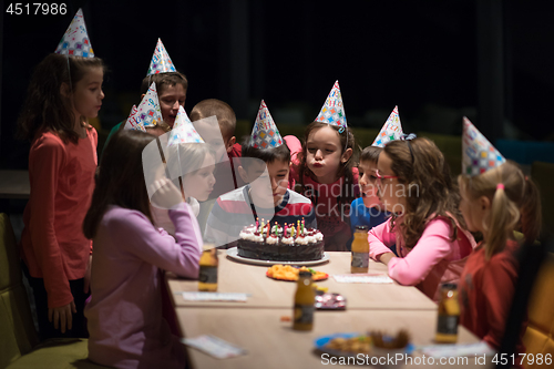 Image of The young boy joyfully celebrating his birthday