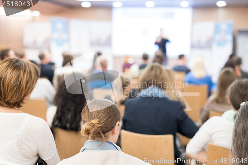 Image of Business speaker giving a talk at business conference event.