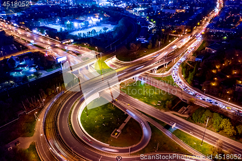 Image of Night Aerial view of a freeway intersection traffic trails in ni